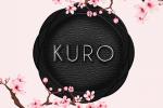 A black circular emblem with the word KURO in white letters, surrounded by pink cherry blossom branches on a light background.