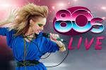 A woman in vibrant 1980s-style clothing sings into a microphone, with bold makeup and big hair. Next to her, colorful text reads “80s LIVE” against a dynamic, bright background.
