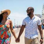 sexy couple of Color enjoying summer fun on the Atlantic City Boardwalk promenade